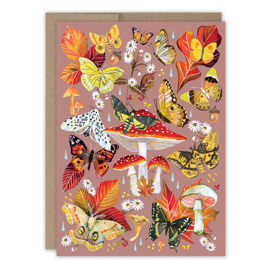 Greeting card with colorful butterflies, leaves, and mushrooms on a pink background
