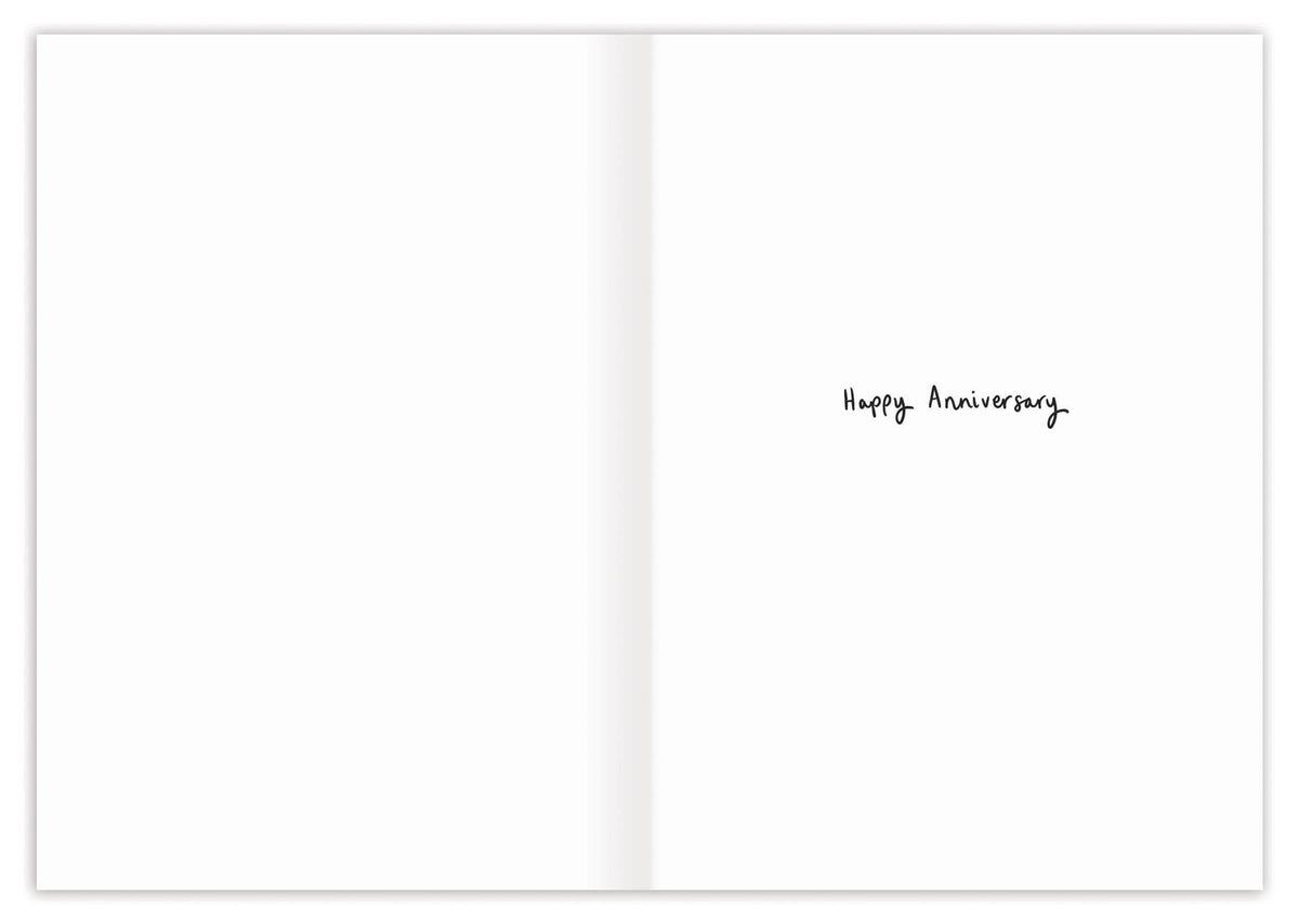 Open book with 'Happy Anniversary' text on a white background