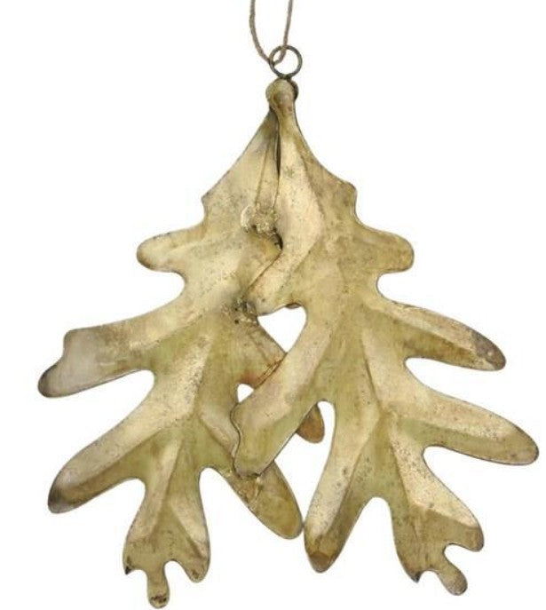 Pair of brass-finished metal oak leaf ornaments, 5.5 by 6.5 inches, versatile fall and Christmas holiday decoration for wreaths, mantels, or tables.