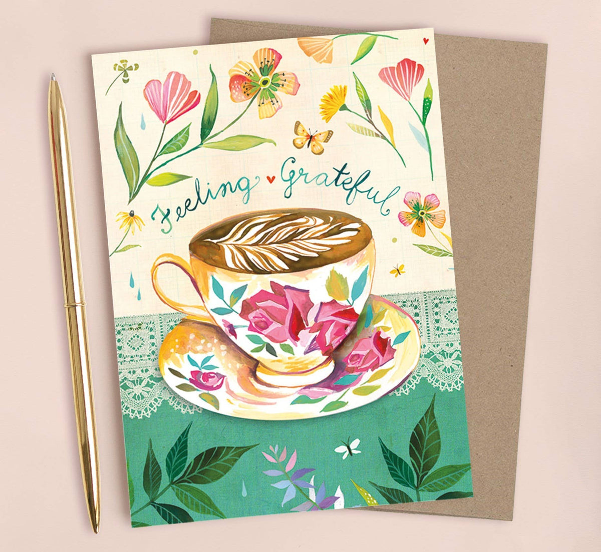 Greeting card with a floral design and 'Feeling Grateful' text, featuring a coffee cup and saucer illustration.
