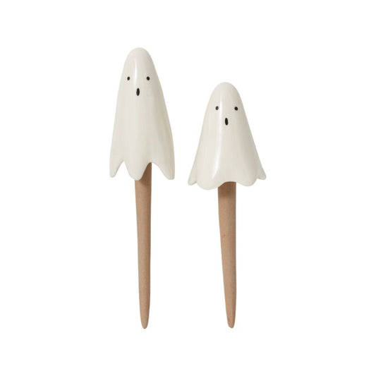 two ceramic ghost plant picks on wooden stakes, spooky Halloween decorations for houseplants and seasonal home décor.