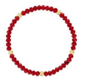 A beaded stretch bracelet made of faceted red beads with small gold spacer beads, shown on a plain white background.