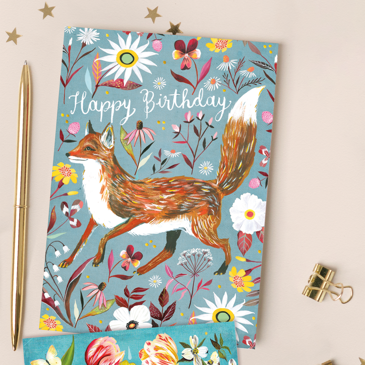 Greeting card with a fox design and 'Happy Birthday' text on a floral background