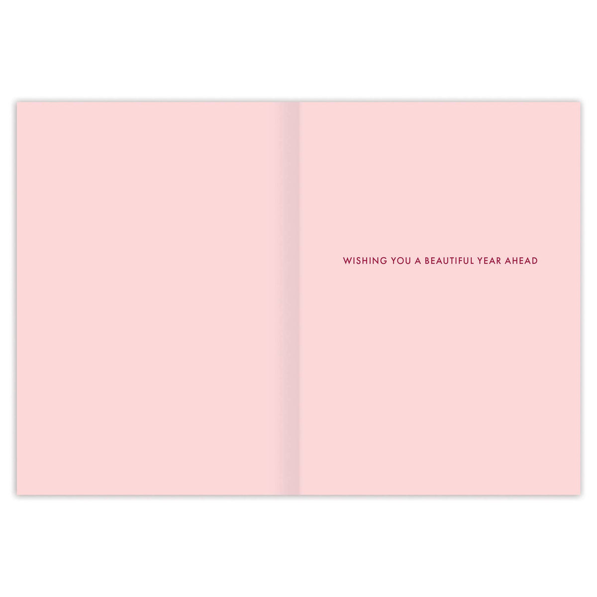 Open pink card with text 'Wishing you a beautiful year ahead' on a white background