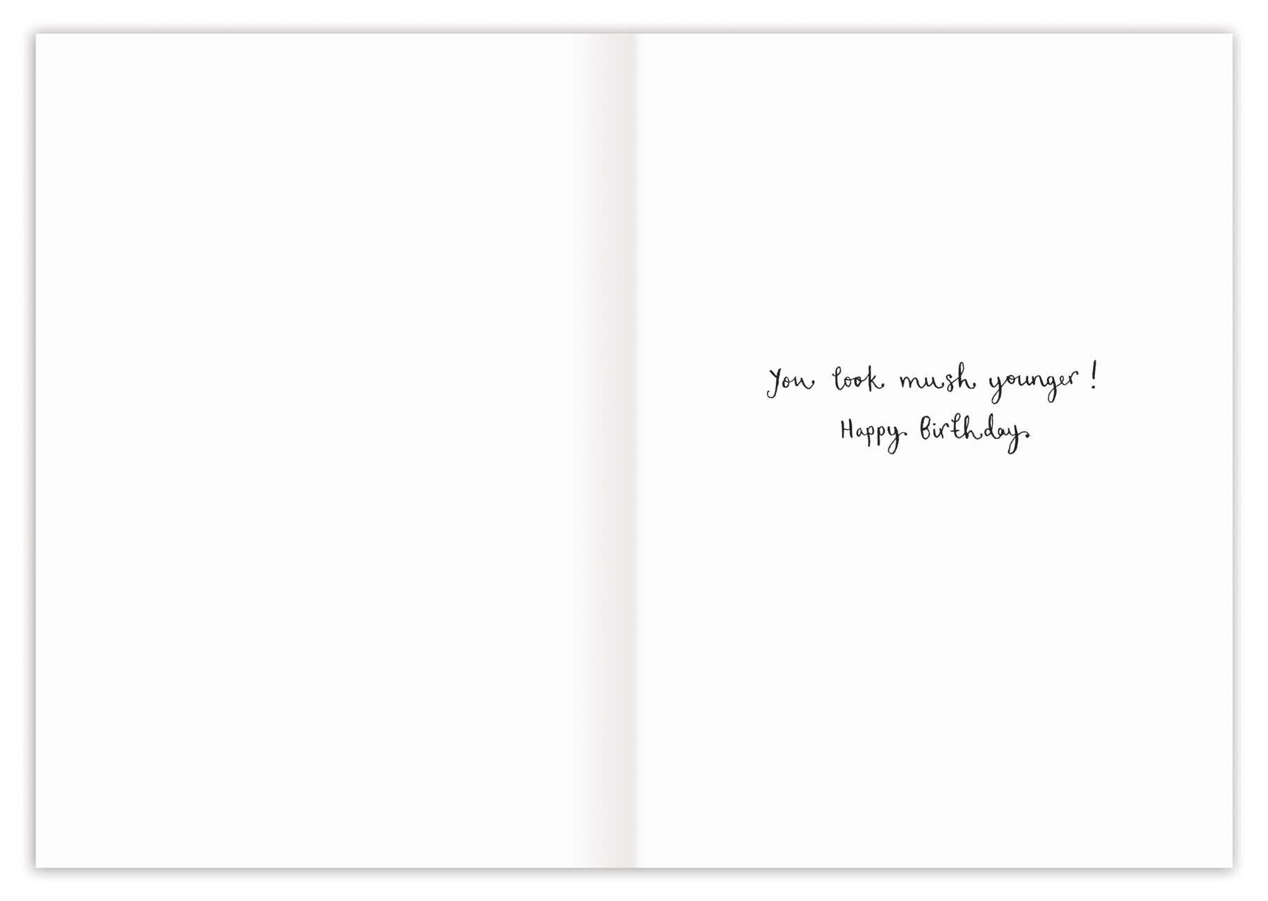 Open card with birthday message on a white background