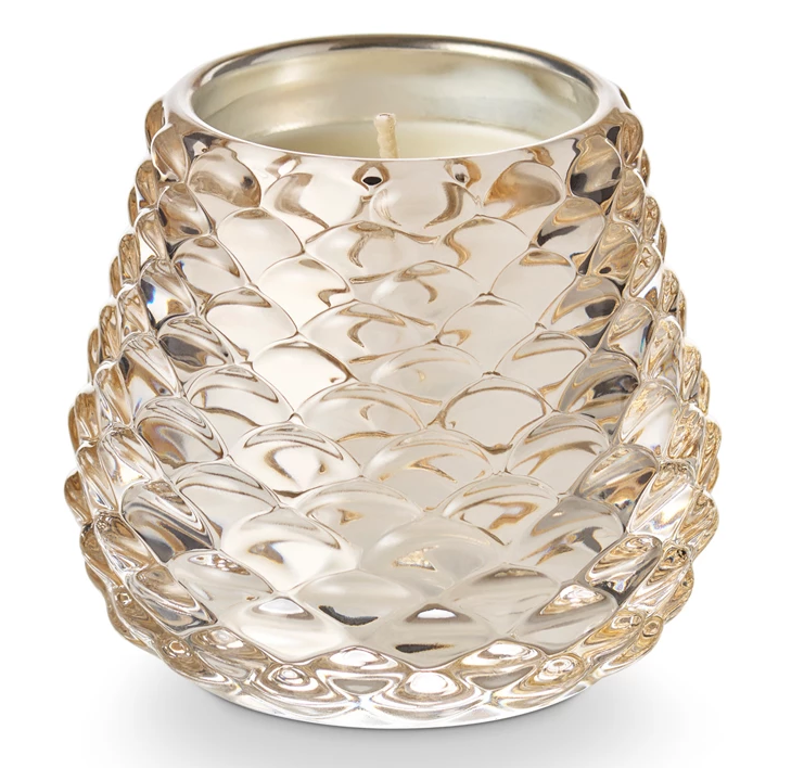 Winter White Pinecone Votive Candle by Illume in frosted pinecone-shaped glass with cardamom, evergreen, and citrus fragrance notes.
