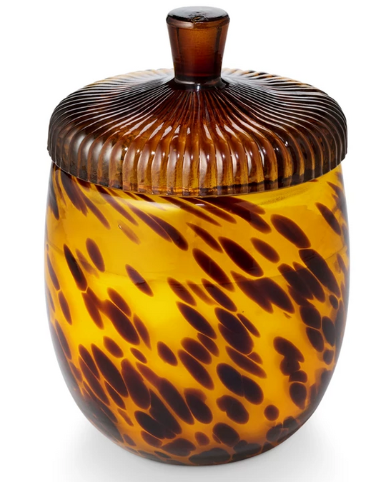 Illume Woodfire Glass Acorn Candle in tortoiseshell-patterned glass with autumnal lid, featuring smoky cedar, suede, and amber fragrance.