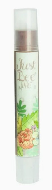 Lip balm with 'Just Bee Bare' branding and floral design on a white background
