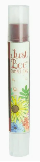 Lip balm with floral design and 'Just Bee' branding on a white background