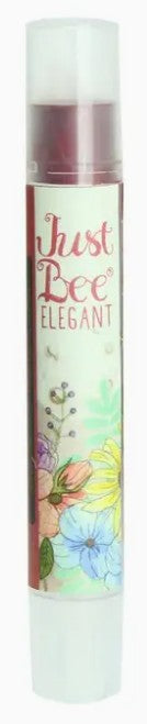 Lip balm with floral design and 'Just Bee' branding on a white background