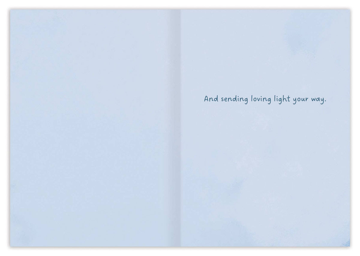 Open book with a light blue cover displaying text on a white background