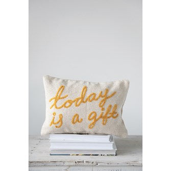 Decorative pillow with 'Today is a gift' text on a white surface