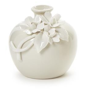 White ceramic vase with floral design on a white background