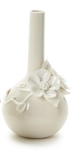 White ceramic vase with floral decorations on a white background