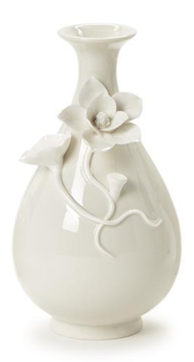 White ceramic vase with floral decorations on a white background