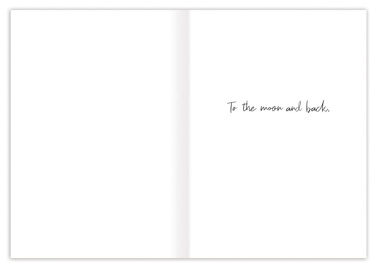 Open book with text 'To the moon and back' on a white background