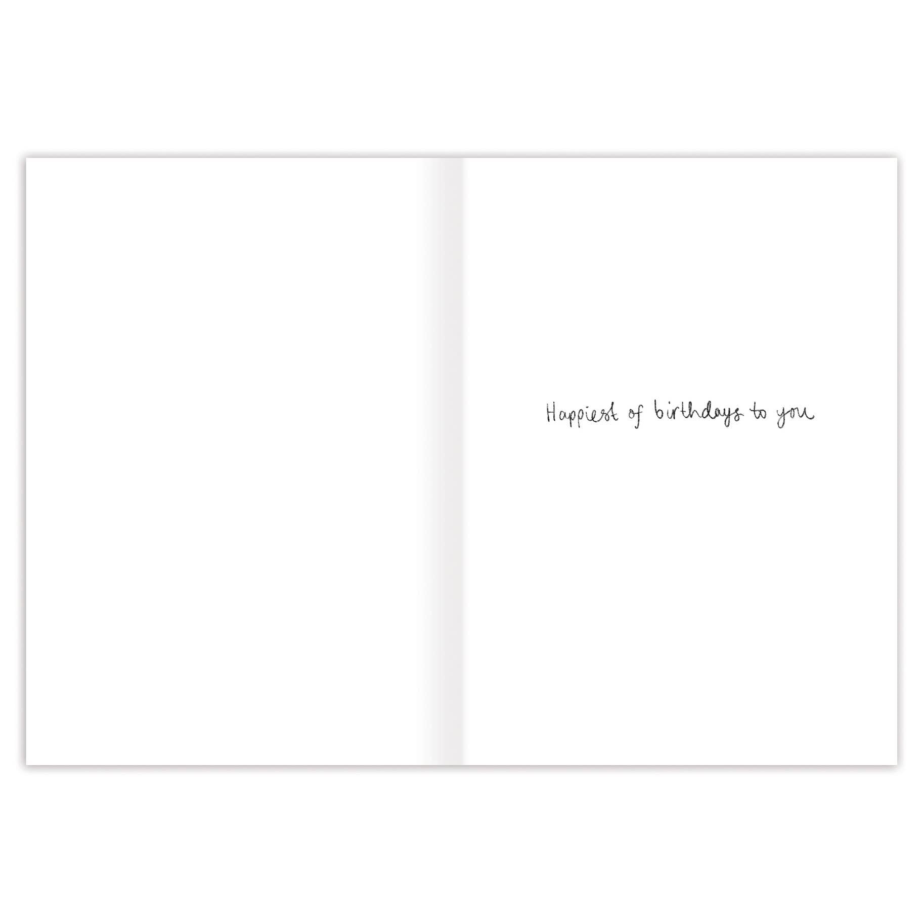 White card with black text 'Happiest of birthdays to you' on a white background