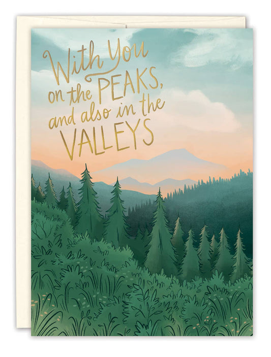 Greeting card with mountain landscape and text 'With you on the peaks, and also in the valleys'.