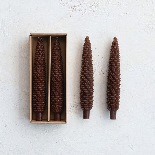 Two brown pinecone-shaped taper candles, 10" tall, unscented, perfect for cottagecore décor, Thanksgiving, Christmas, or cozy winter displays.
