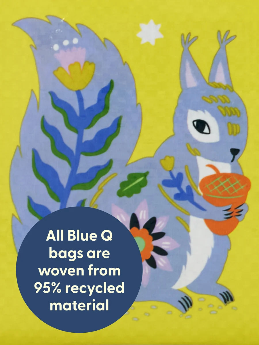 Illustration of a blue squirrel holding a woven basket with flowers on a yellow background, featuring a Blue Q product label.