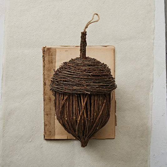 Large 13-inch rattan acorn décor piece with handcrafted texture, styled on a mantel with fall accents.
