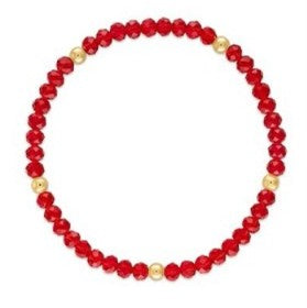 A beaded stretch bracelet made of red faceted beads with alternating small gold metallic spacer beads, shown on a plain white background.