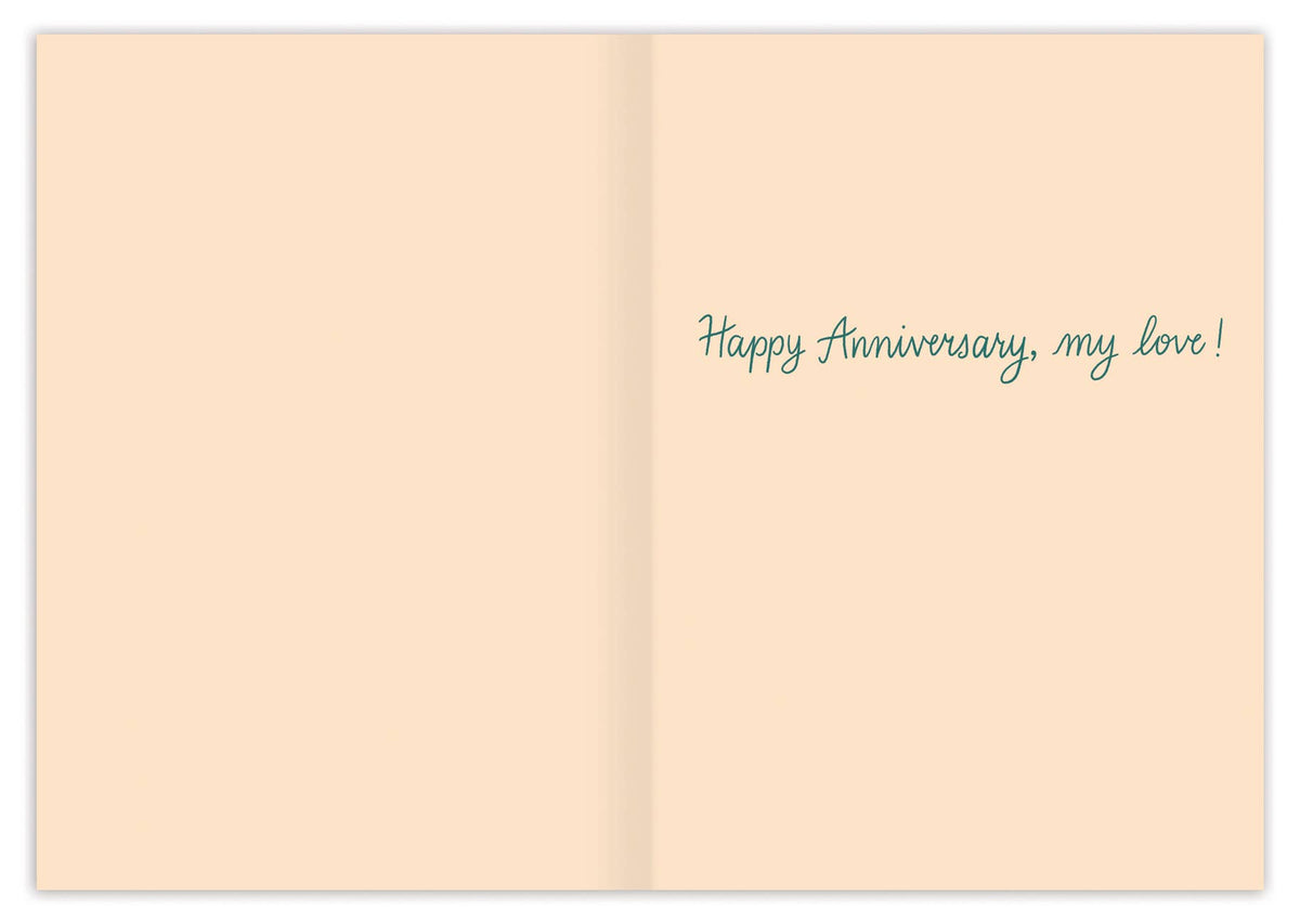 Open card with 'Happy Anniversary, my love!' text on a beige background