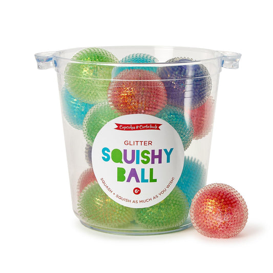 Cupcakes & Cartwheels Squishy Glitter Ball Toys in blue, green, red, and purple, soft and squeezable with glitter inside for playful fun and stress relief.