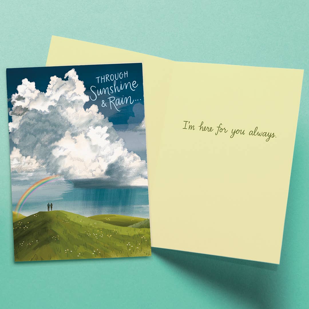 Greeting card with cloud and rainbow illustration on a teal background