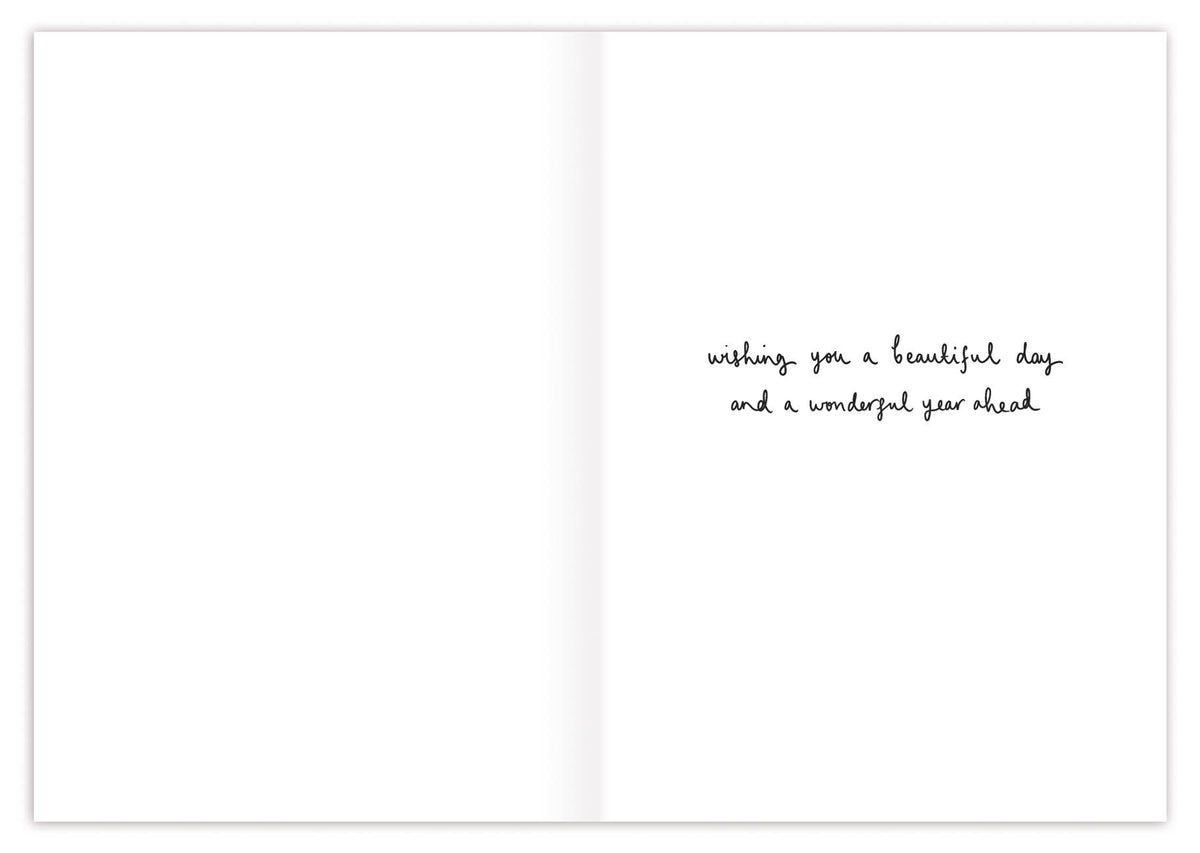Greeting card with text 'wishing you a beautiful day and a wonderful year ahead' on a white background