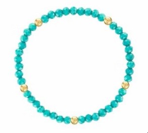 A beaded stretch bracelet featuring round turquoise-blue beads separated by small gold spacer beads, shown on a plain white background.