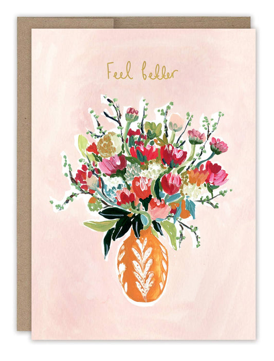 Greeting card with floral design and 'Feel better' text on a pink background