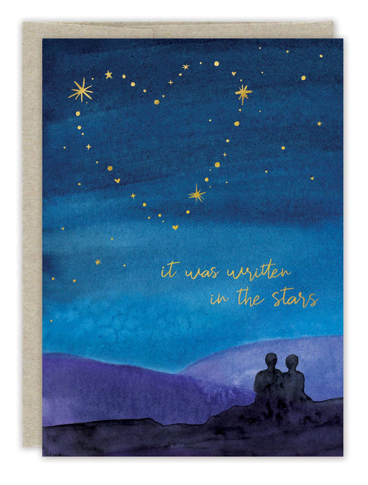 Greeting card with a night sky, stars, and two silhouettes under the text 'it was written in the stars'.