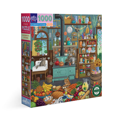 A 1000-piece jigsaw puzzle box titled 'Alchemist's Kitchen', featuring a colorful, detailed illustration of a whimsical kitchen filled with cooking utensils, ingredients, and cats.