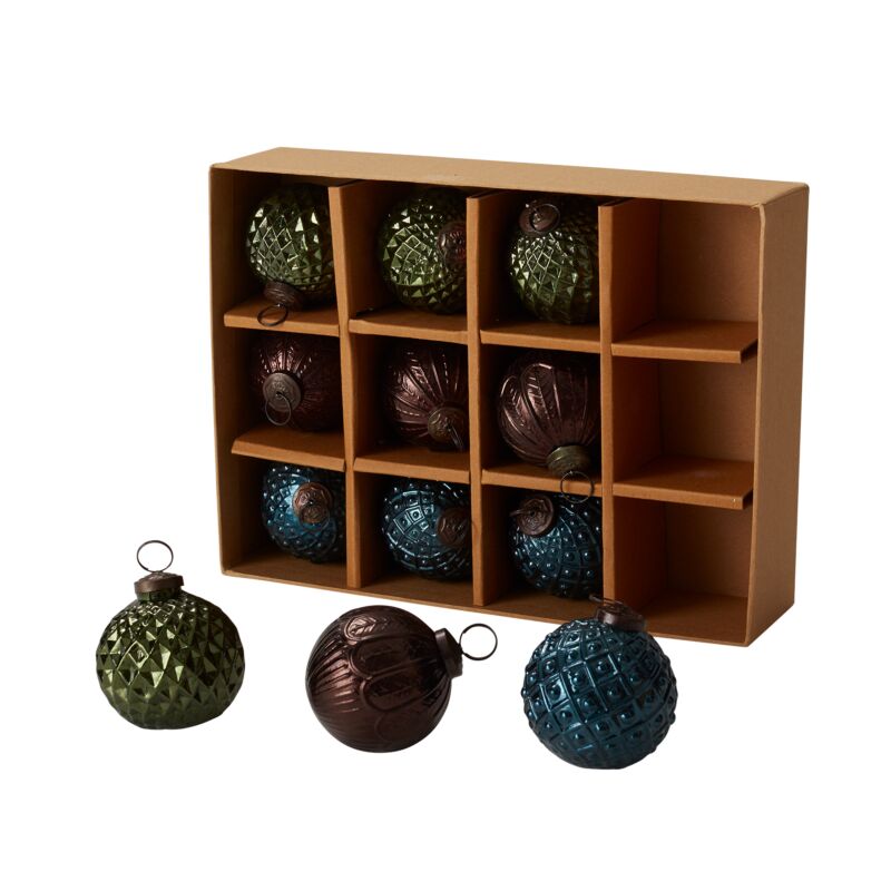 Twelve textured Angelica glass Christmas ornaments arranged in a divided storage box.
