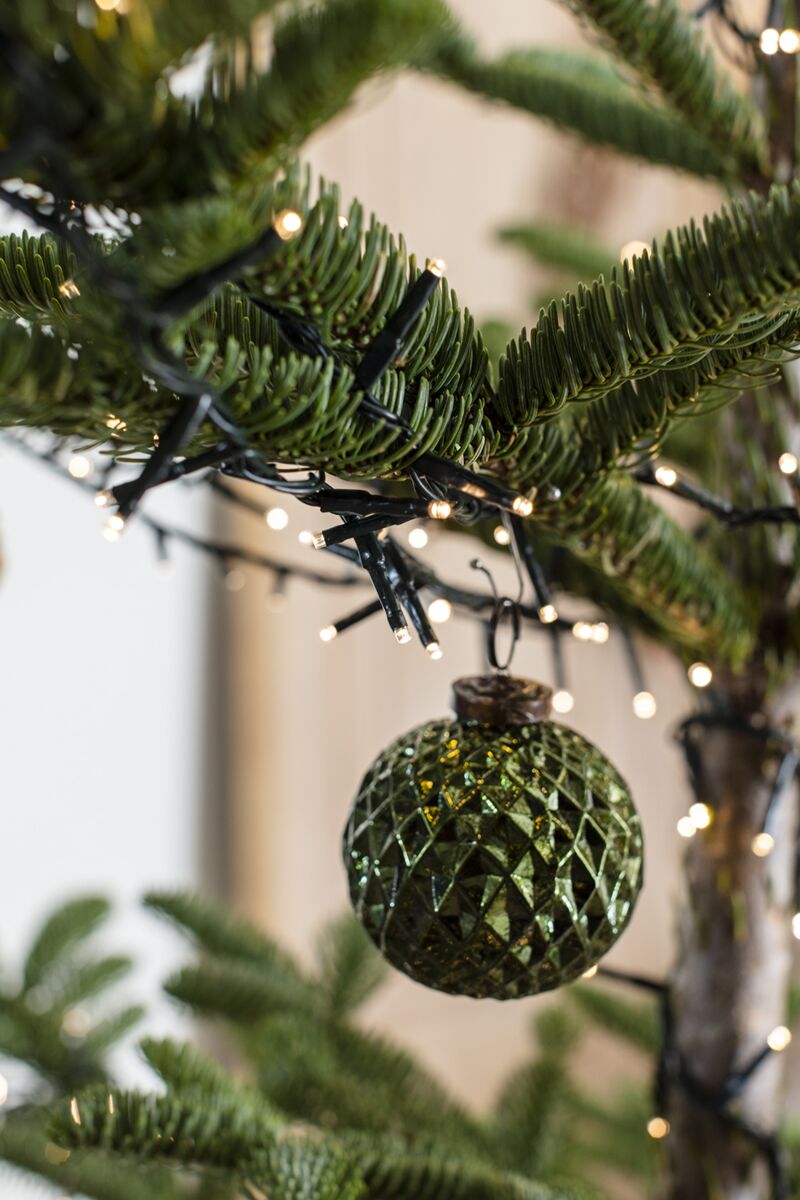 Textured Angelica Christmas ornament with bronze-toned cap hanging on a Christmas tree.