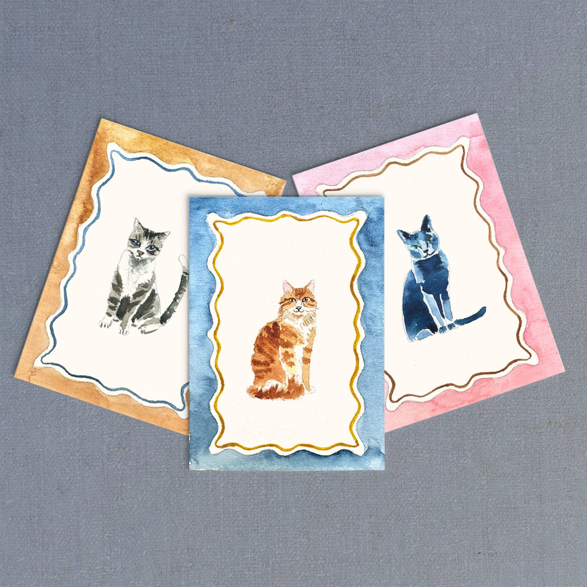 Three miniature cat watercolor illustrations with colorful decorative borders from Antiquaria