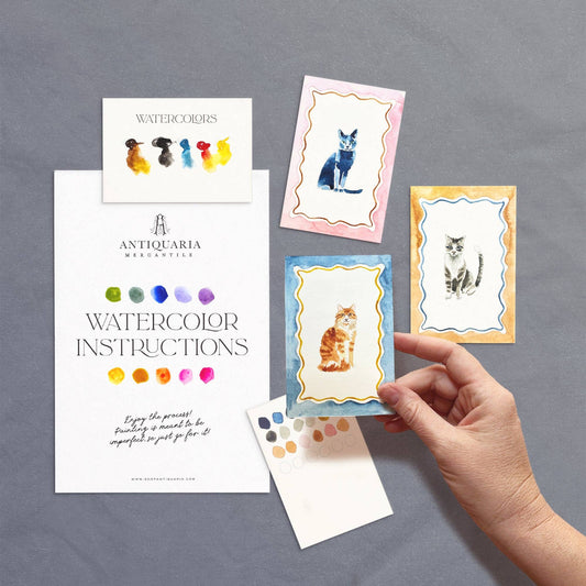 Antiquaria Mini Cats Watercolor Painting Kit with three illustrated cat designs, watercolor paints, and painting instructions