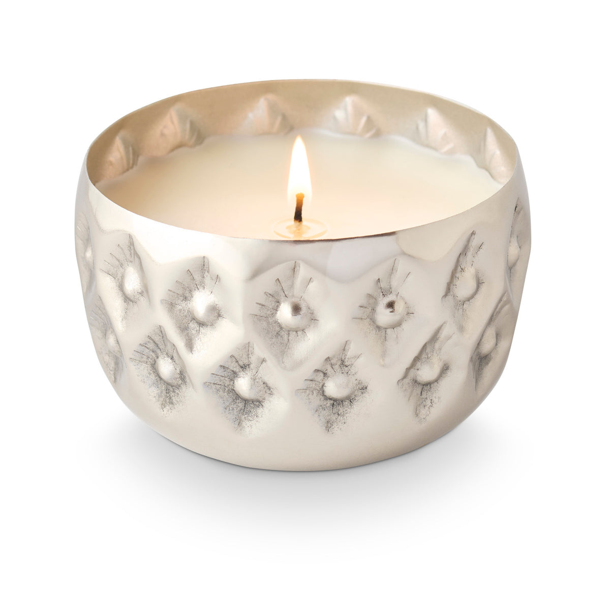 Balsam & Cedar pressed-metal candle with raised geometric pattern and softly scalloped edge.