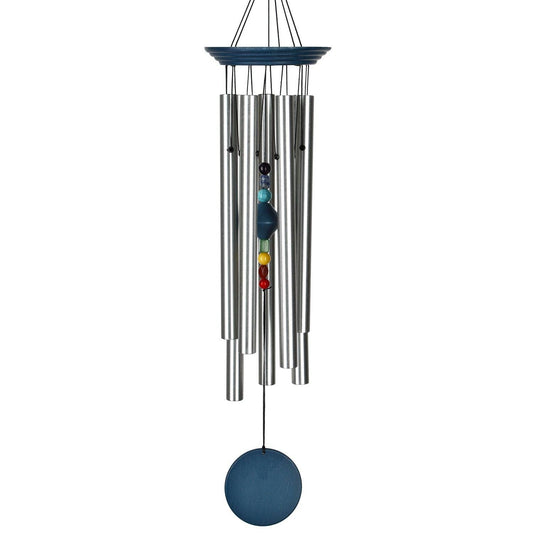 Woodstock Chakra Chime with seven silver tubes, blue wood finish, and clapper featuring seven chakra stones aligned in a column.