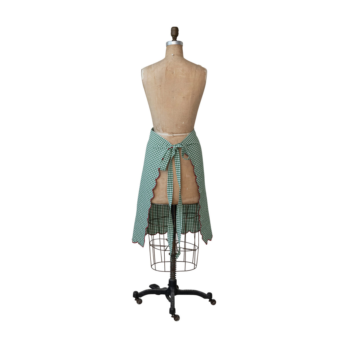 Back view of green gingham cotton half apron showing adjustable waist ties.