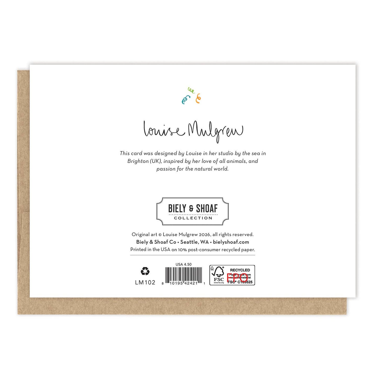 A square white paper card with printed text and a small colorful bird illustration, shown resting on top of a brown kraft envelope against a white background. The card reads 'BIELY & SHOAF COLLECTION'.
