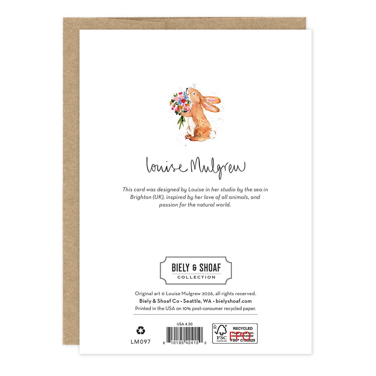 A square white greeting card from the Biely & Shoaf Collection, featuring a watercolor illustration of a brown rabbit holding a colorful flower bouquet. The card is displayed in front of a brown kraft envelope on a clean white background.