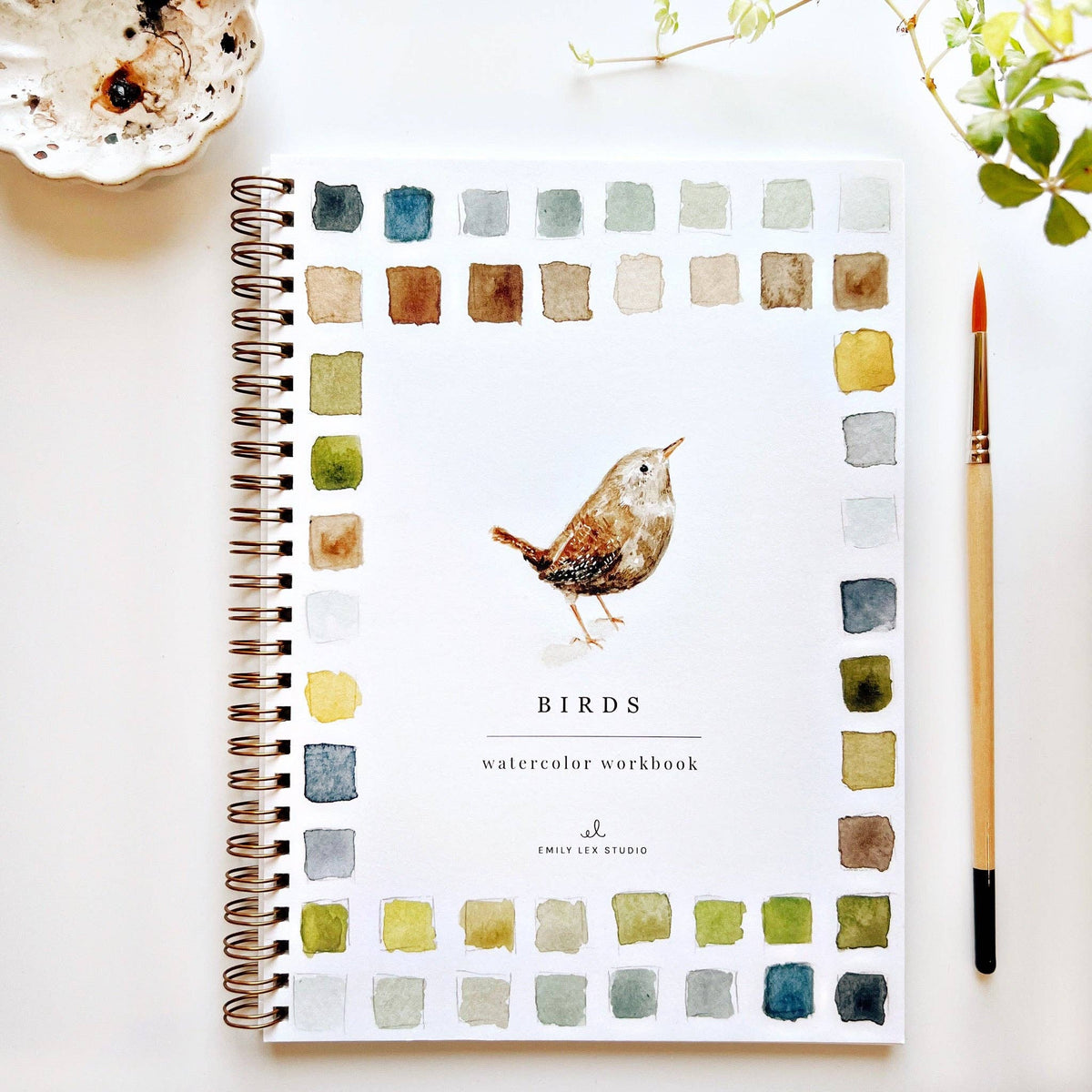 Emily Lex Studio Birds Watercolor Workbook on white background with a paintbrush and small paint palette
