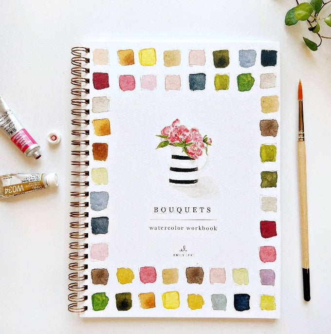 Emily Lex Studio Bouquets Watercolor Workbook on white background with paintbrush and paint tubes