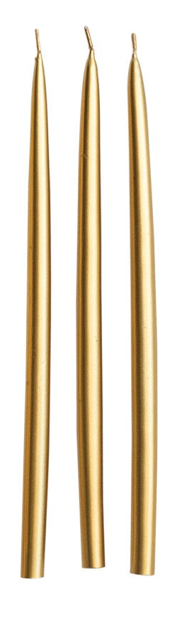 Three slim tapered candles in a metallic gold finish, standing vertically against a plain white background.