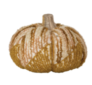 A decorative faux pumpkin with a textured, ribbed surface in shades of tan, beige, and brown, featuring a short, thick stem.