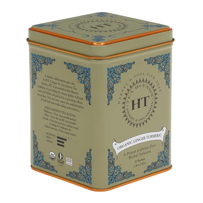 Harney & Sons Organic Ginger Turmeric Tea in a 20-count sachet tin, a ruby-colored caffeine-free blend of ginger, turmeric, apple, and warming spices.