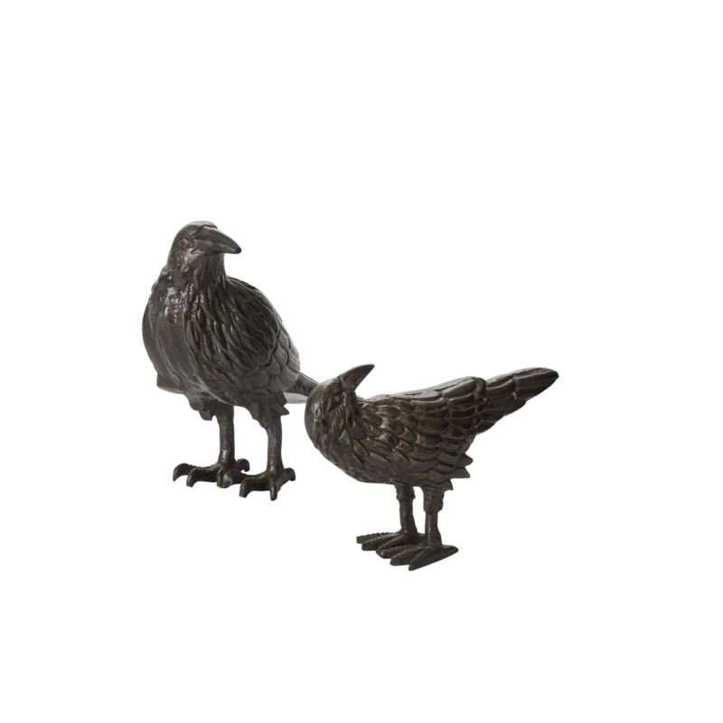 Two Nevermore raven figurines by Accent Decor in dark gunmetal cast aluminum, featuring textured feathers and sculptural bird silhouettes.