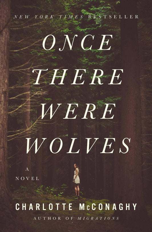 Book cover of 'Once There Were Wolves' by Charlotte McConaghy with a forest background.